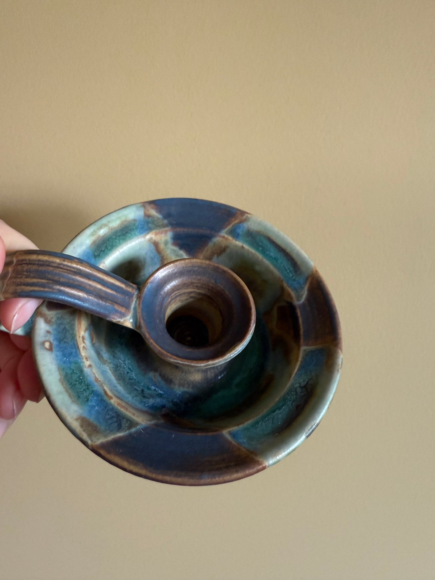 Vintage, handmade pottery candlestick holder.