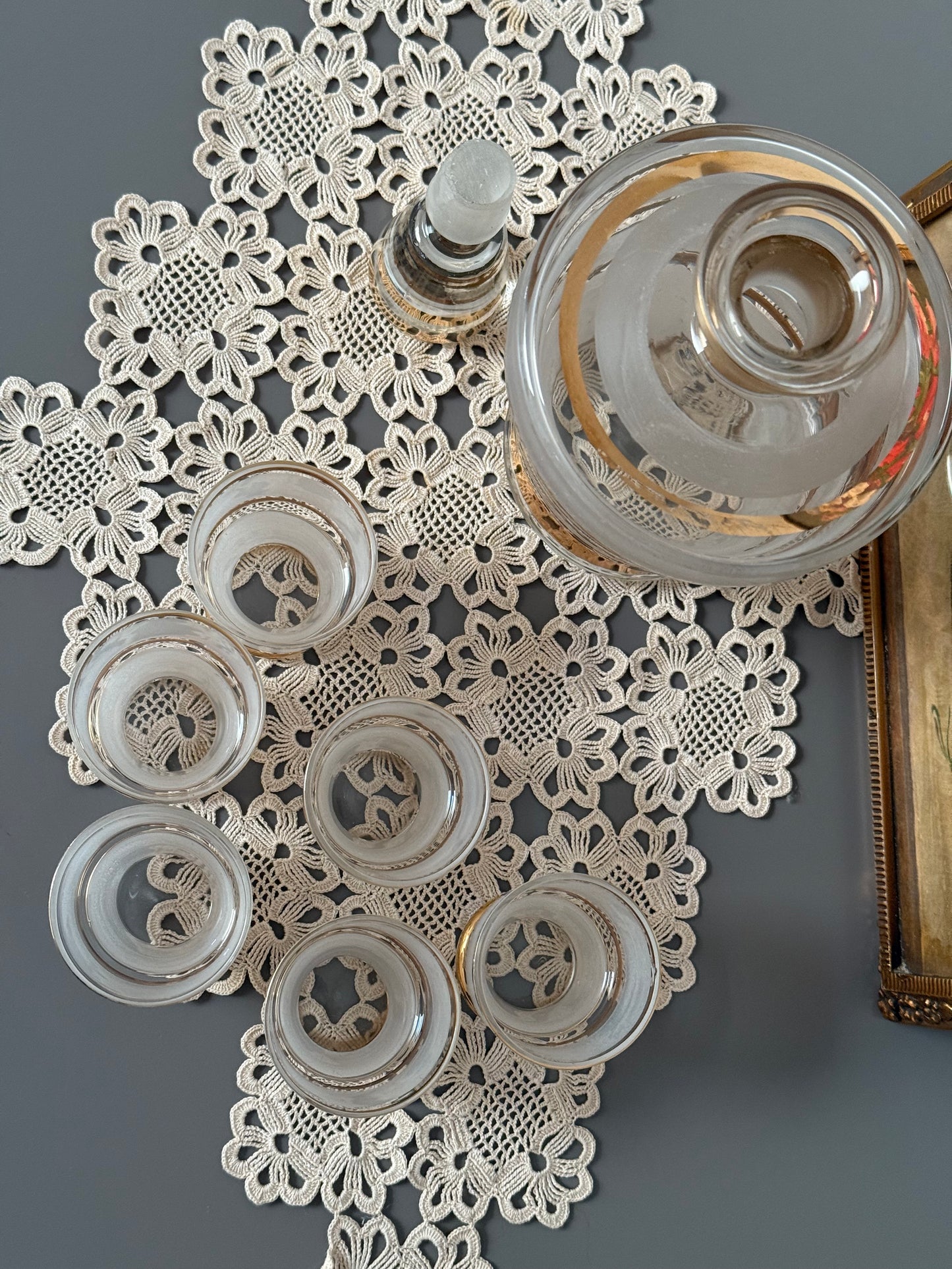 Vintage, liquor frosted glass with gold bands decanter and 6 shot glasses.