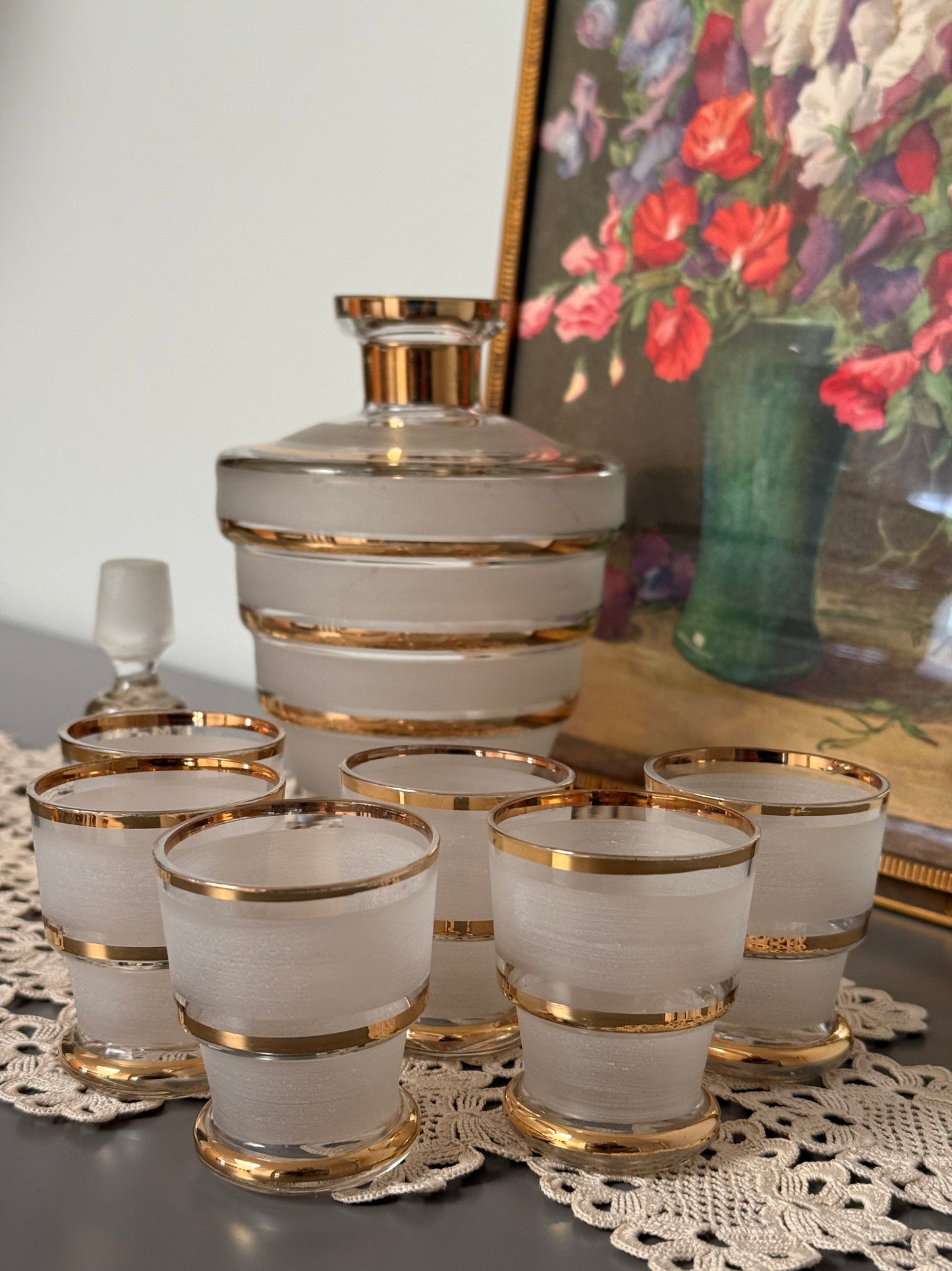 Vintage, liquor frosted glass with gold bands decanter and 6 shot glasses.