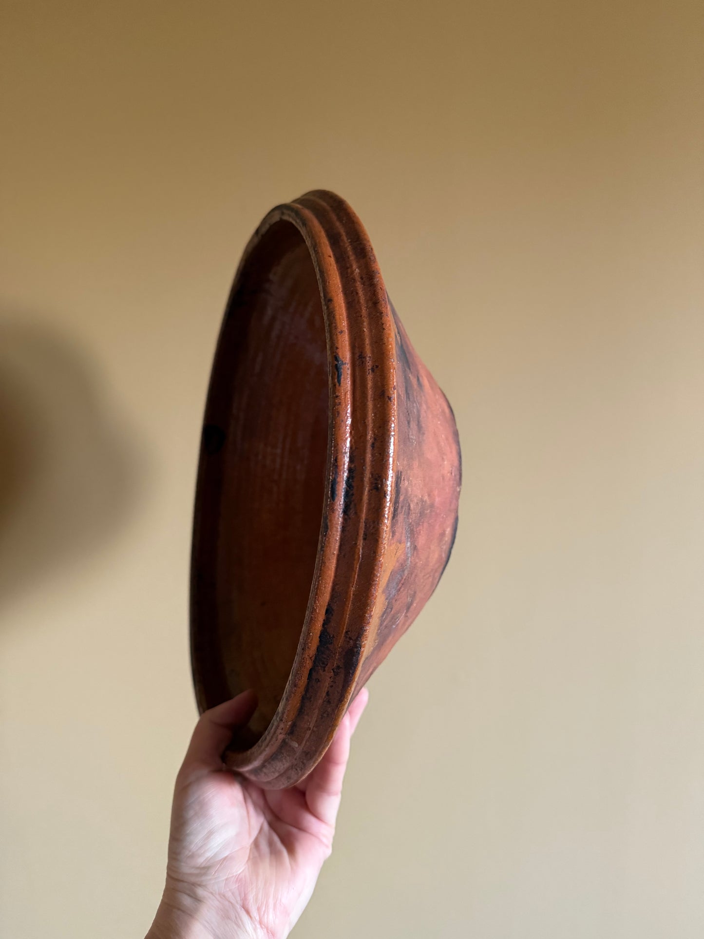 Antique, rustic terracotta dish.