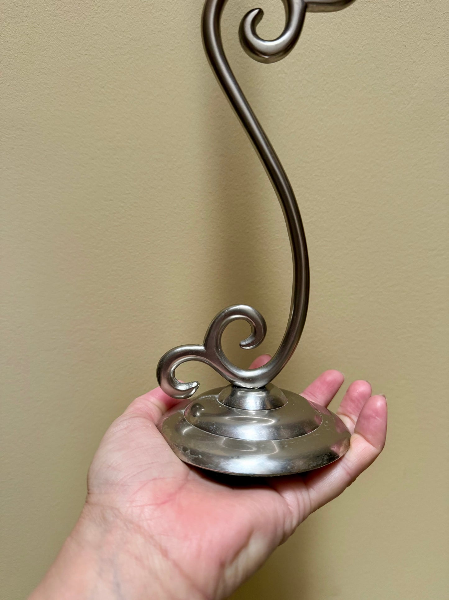 Vintage elegant white metal candlestick holders.