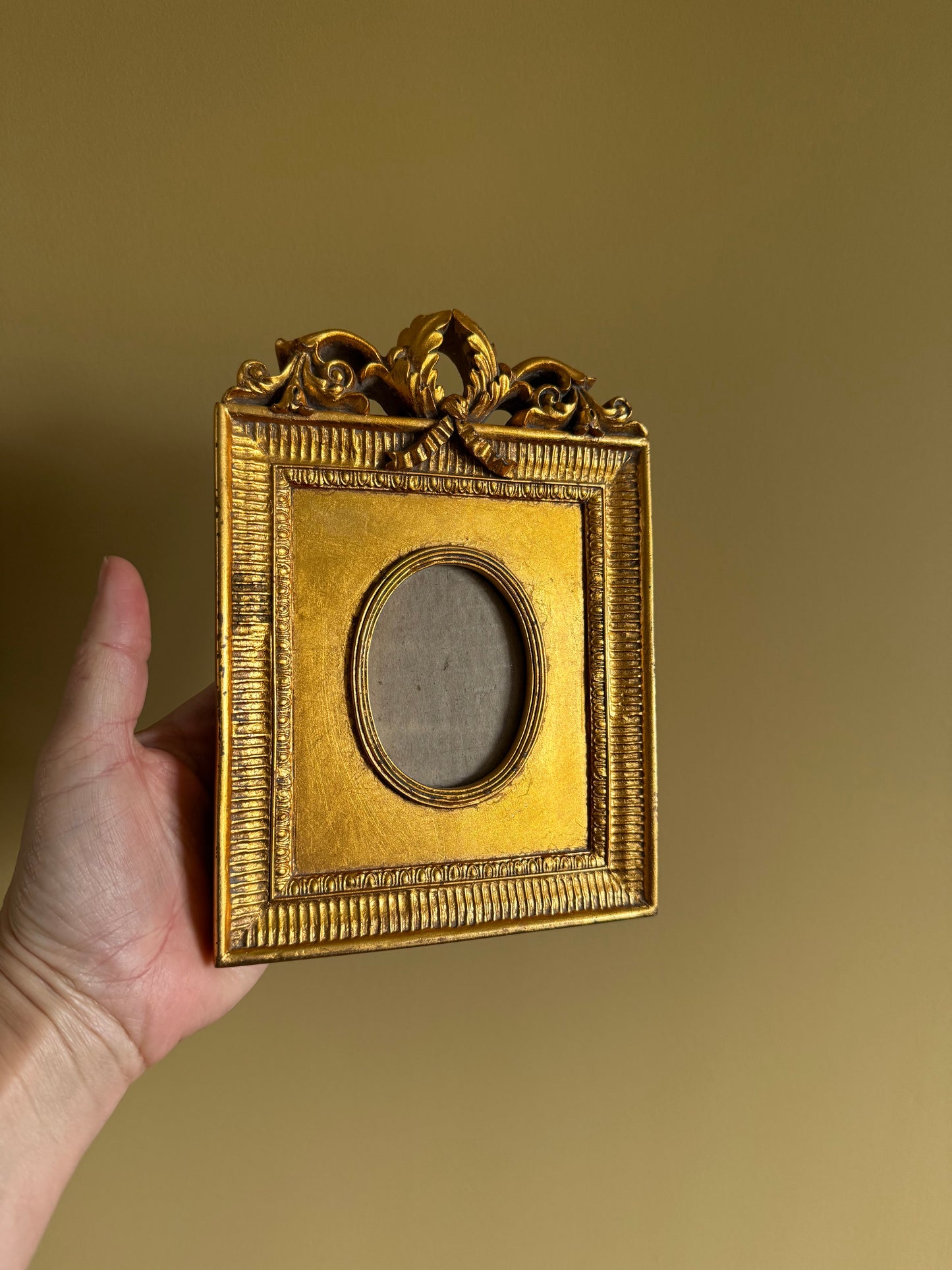 Vintage, ornate gold frame.