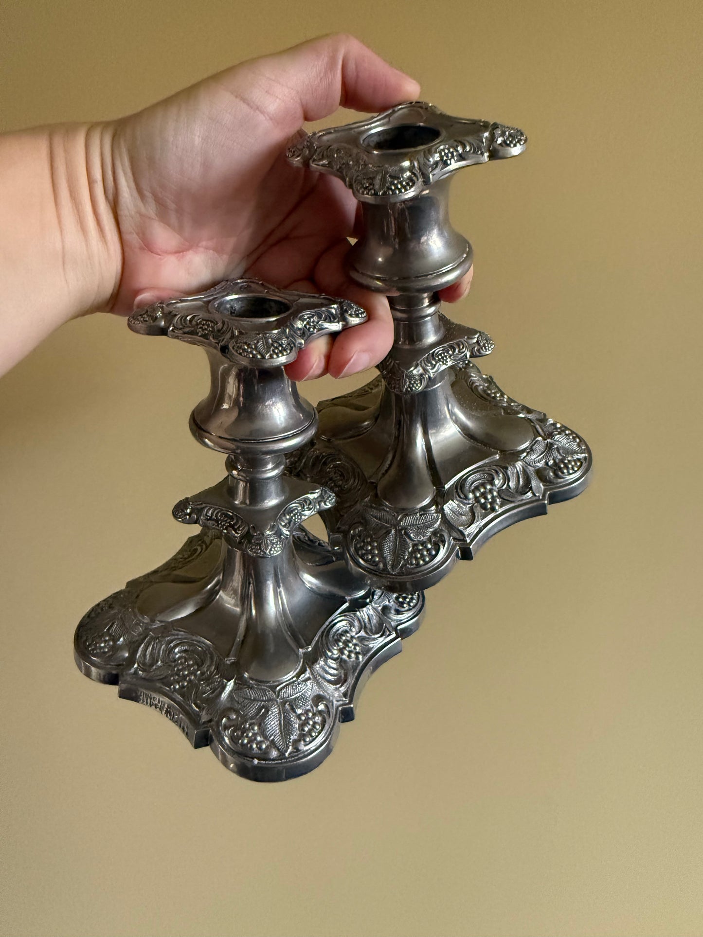 Antique, silver plated candlestick holders.