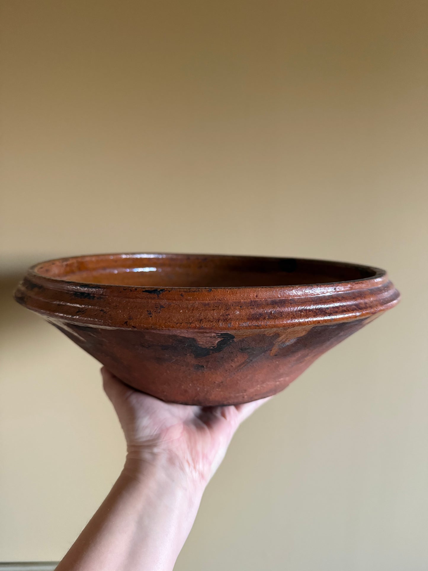 Antique, rustic terracotta dish.