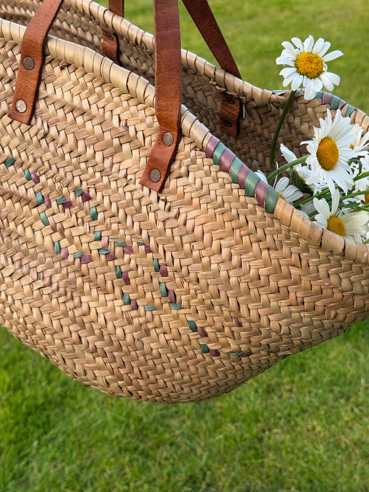 Vintage, genuine leather handles straw basket.