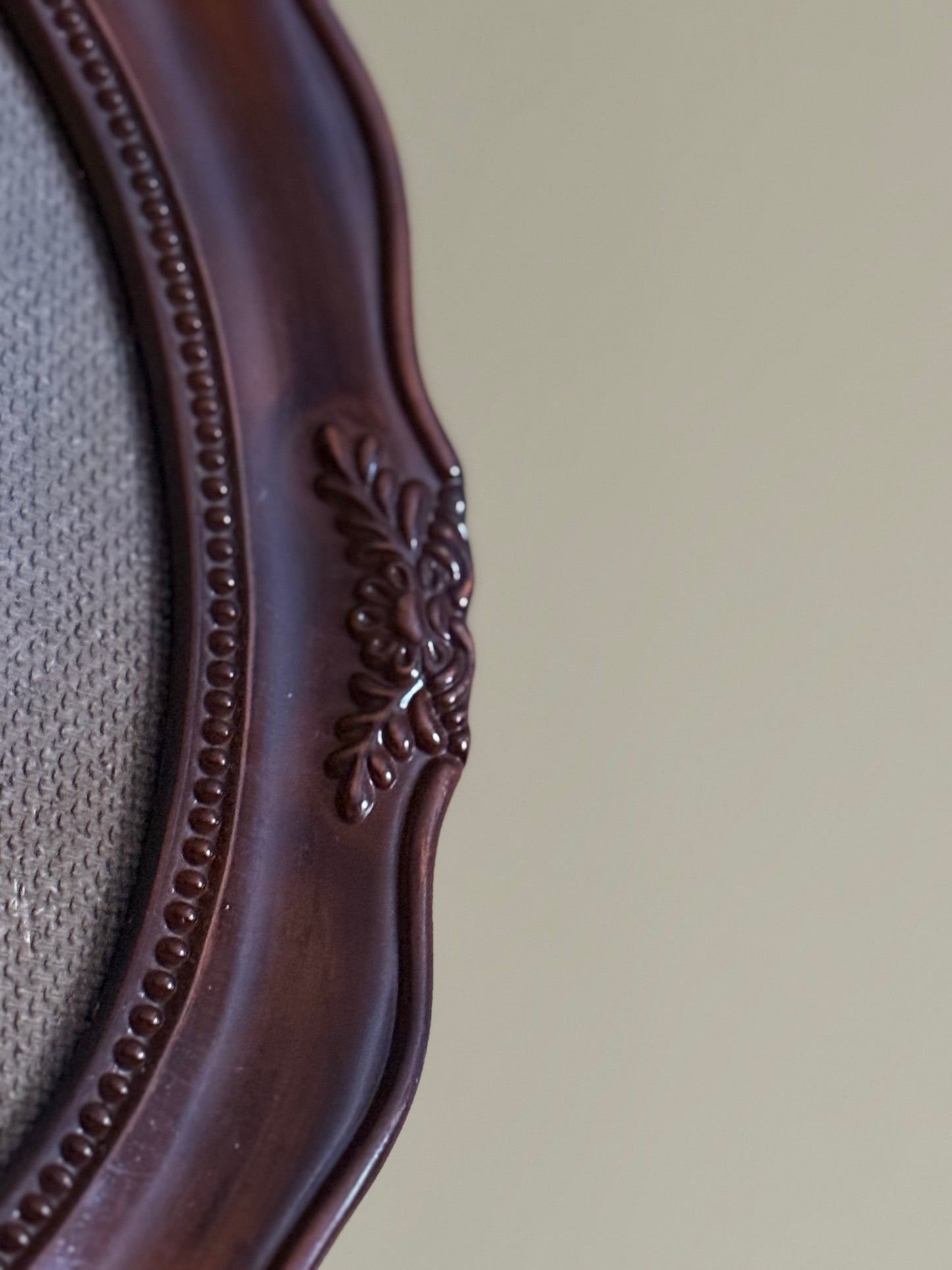 Vintage, oval plastic frame.