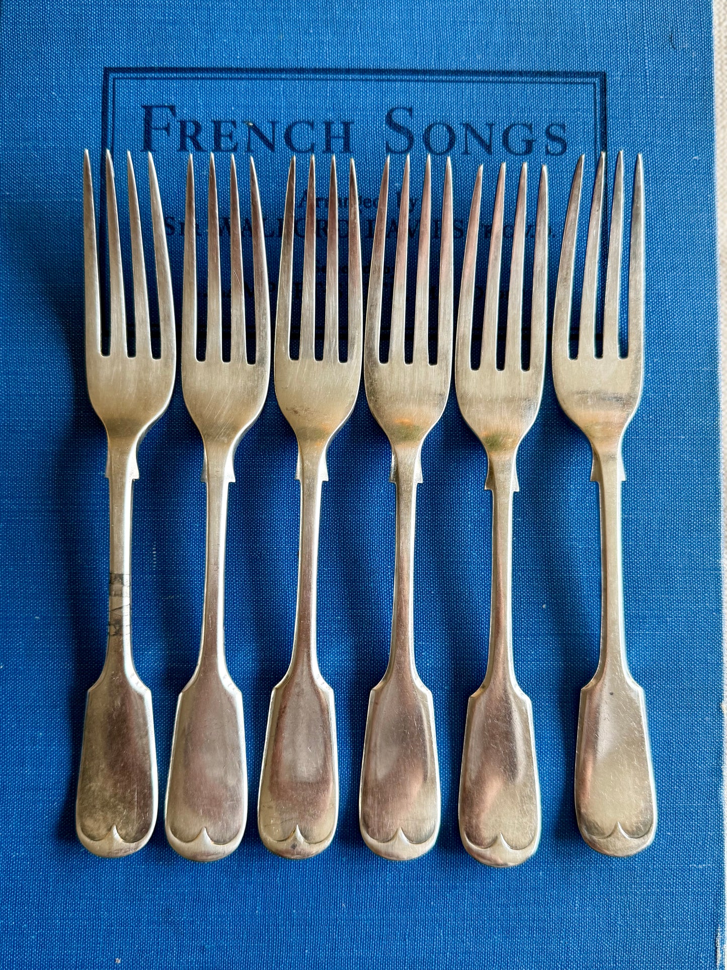 Antique silver plated cake forks.