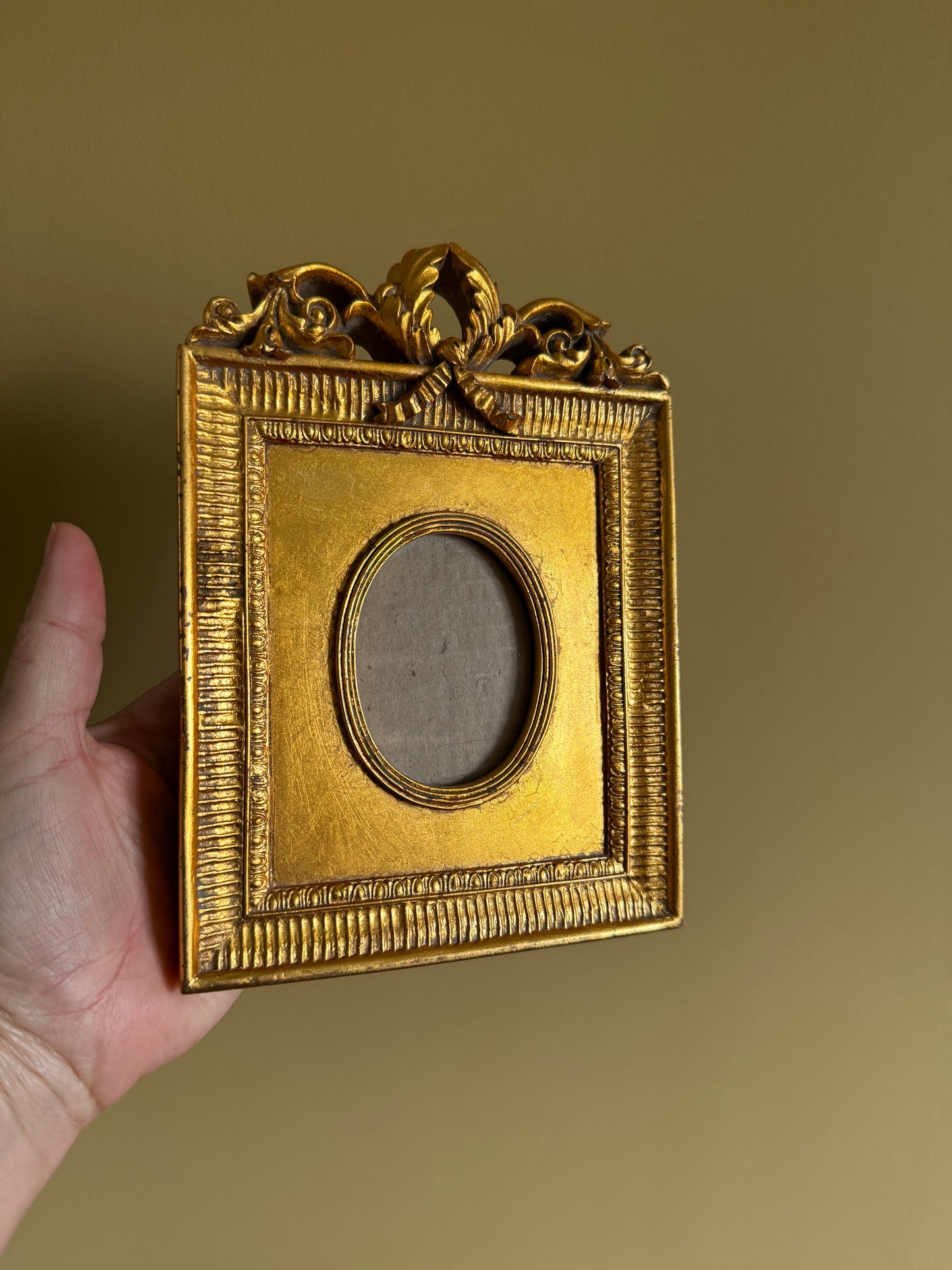 Vintage, ornate gold frame.