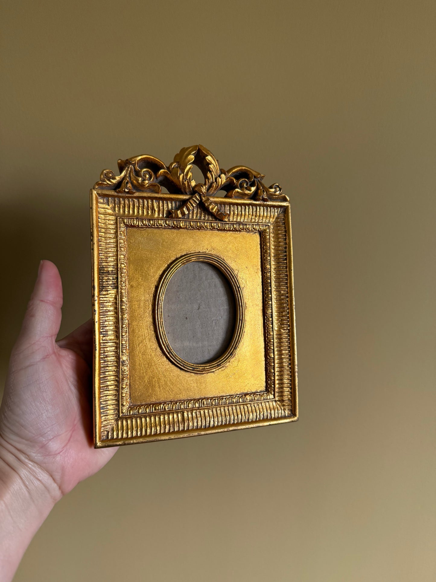 Vintage, ornate gold frame.