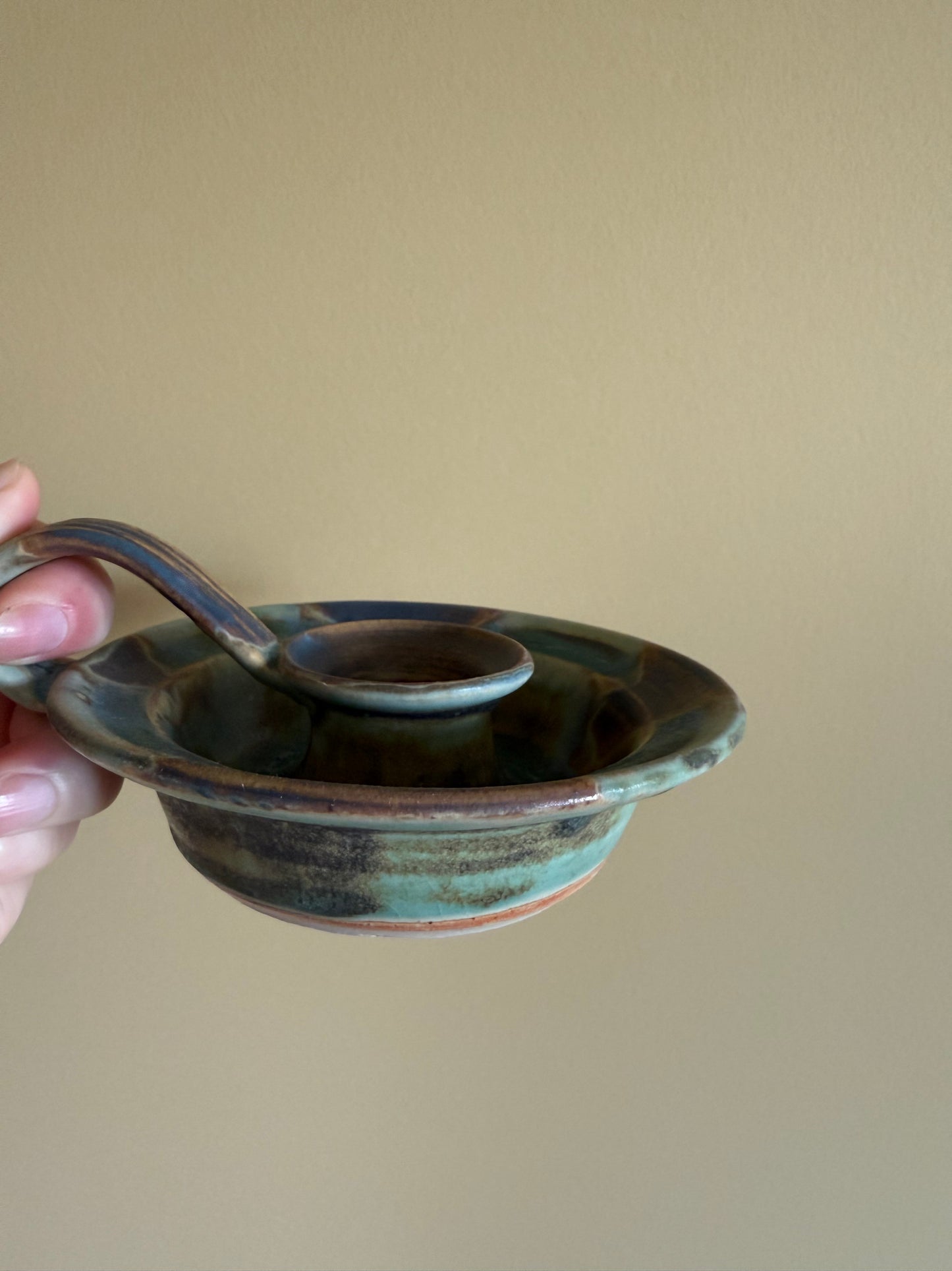 Vintage, handmade pottery candlestick holder.