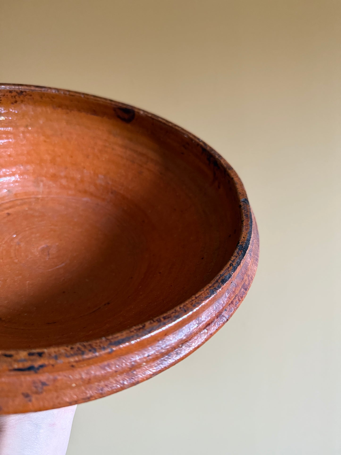 Antique, rustic terracotta dish.