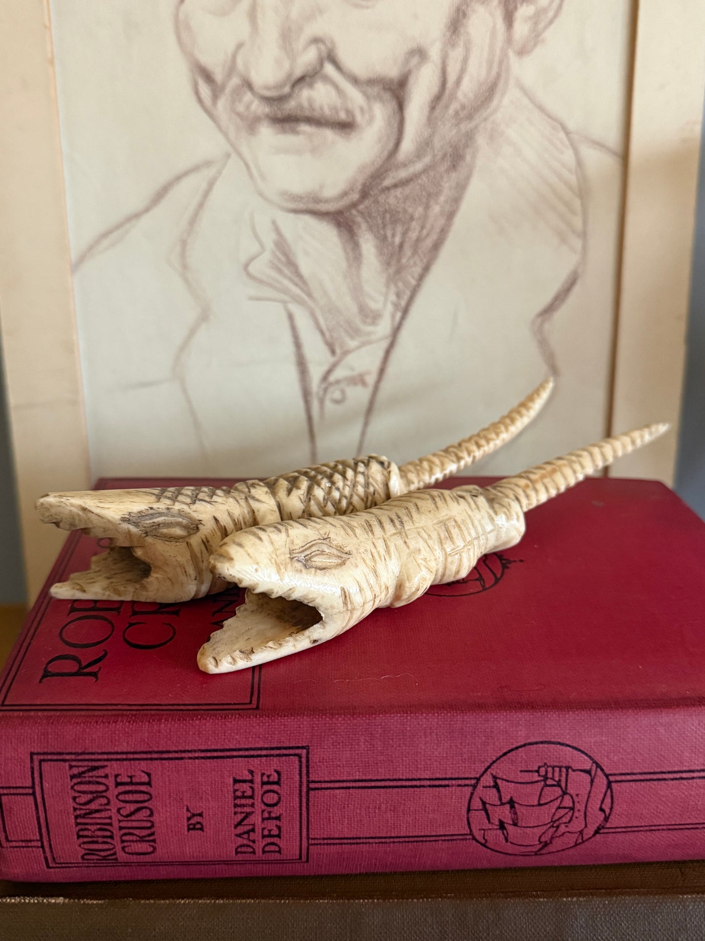 Vintage hand carved bone crocodile sculptures.