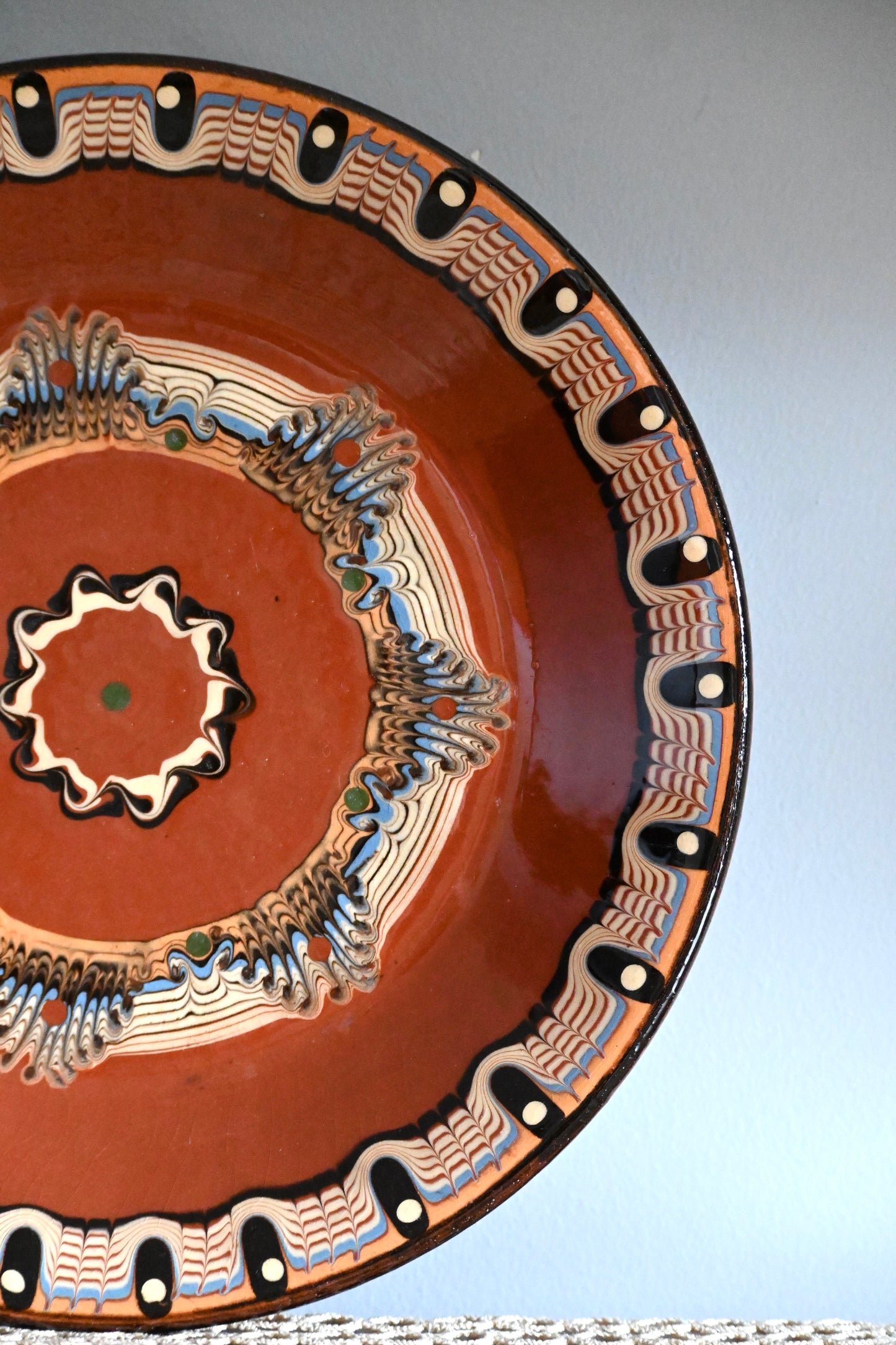 Vintage, handmade terracotta wall plate.