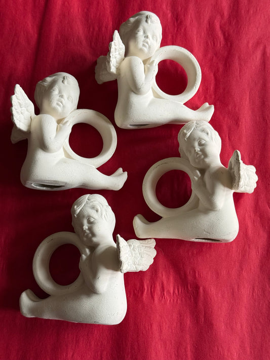 Set of 4 cherub napkin rings.