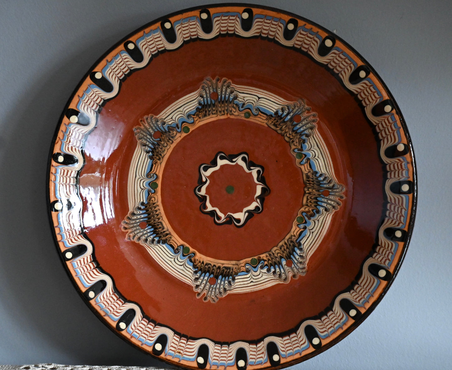 Vintage, handmade terracotta wall plate.