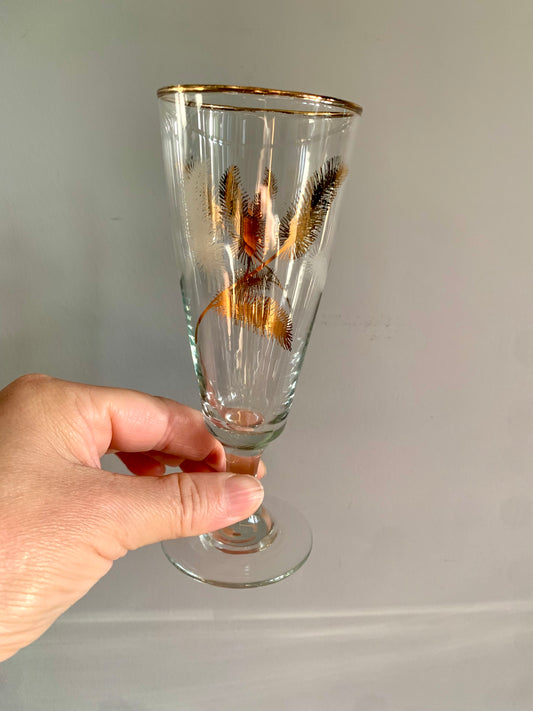 Vintage, gold feather stemmed glasses.