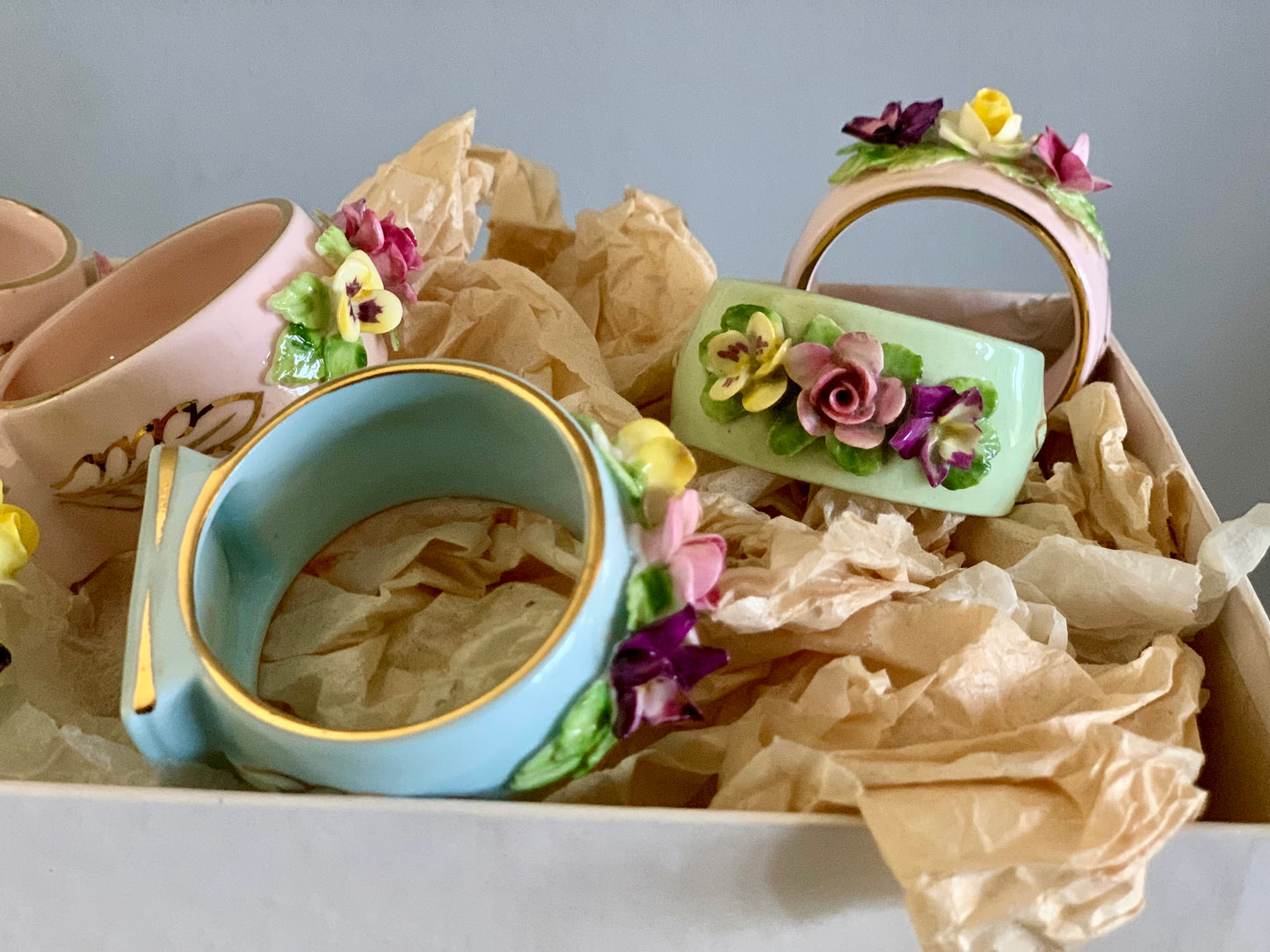 Antique, last century fine bone china, floral napkin rings.