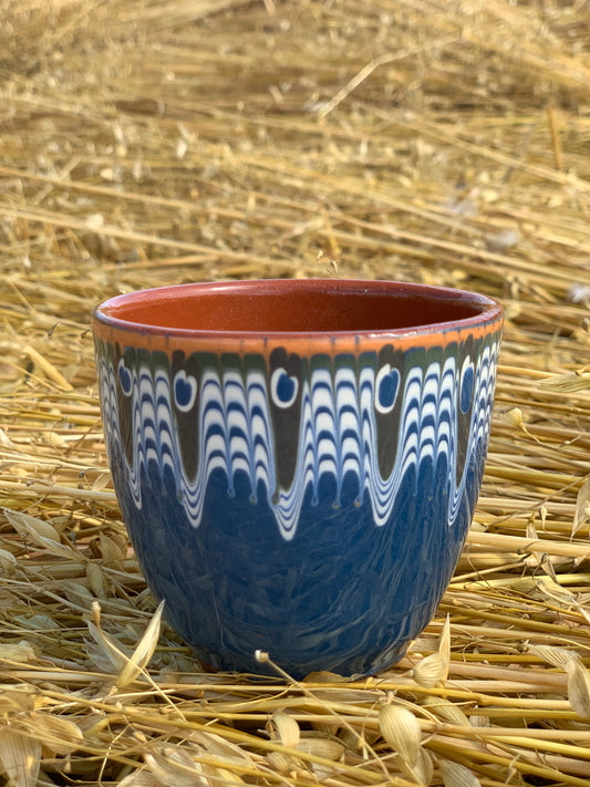 Hand thrown and hand painted, ceramic cups.