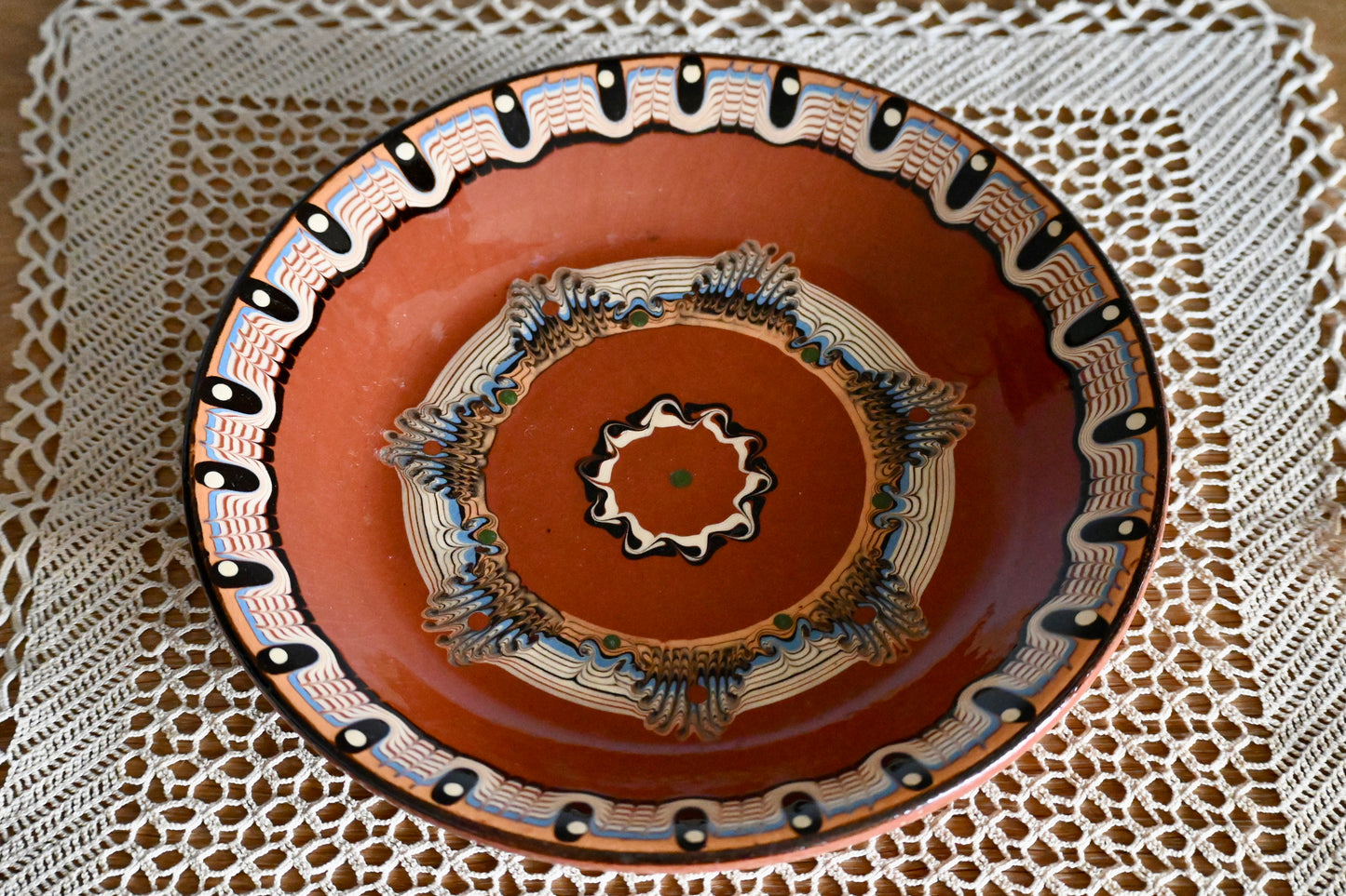 Vintage, handmade terracotta wall plate.