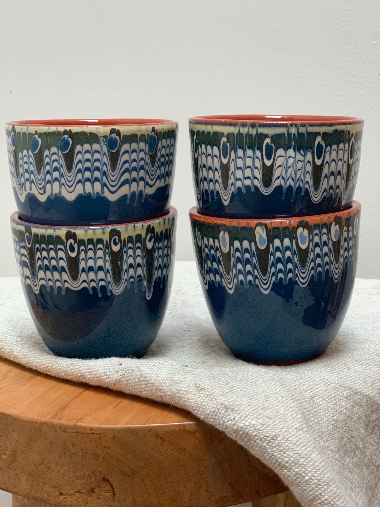 Hand thrown and hand painted, ceramic cups.