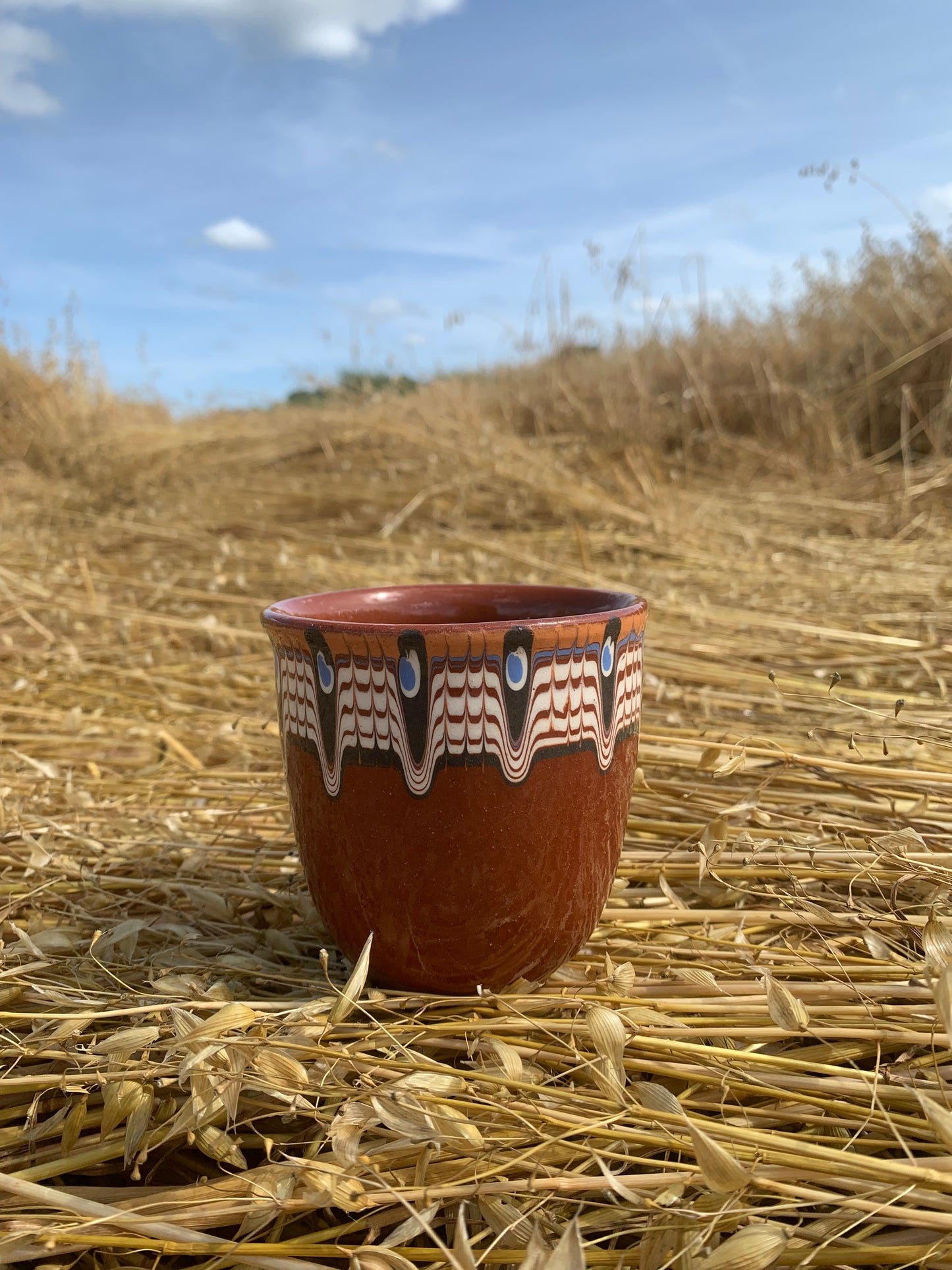 Hand thrown and hand painted, ceramic cups.