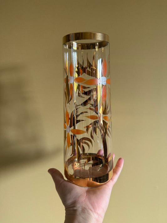 Vintage, hand decorated vase with gold and orange details.