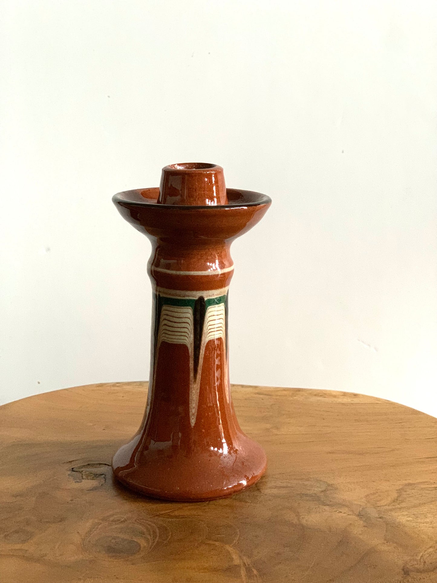 Vintage, handmade and hand painted terracotta candlestick.