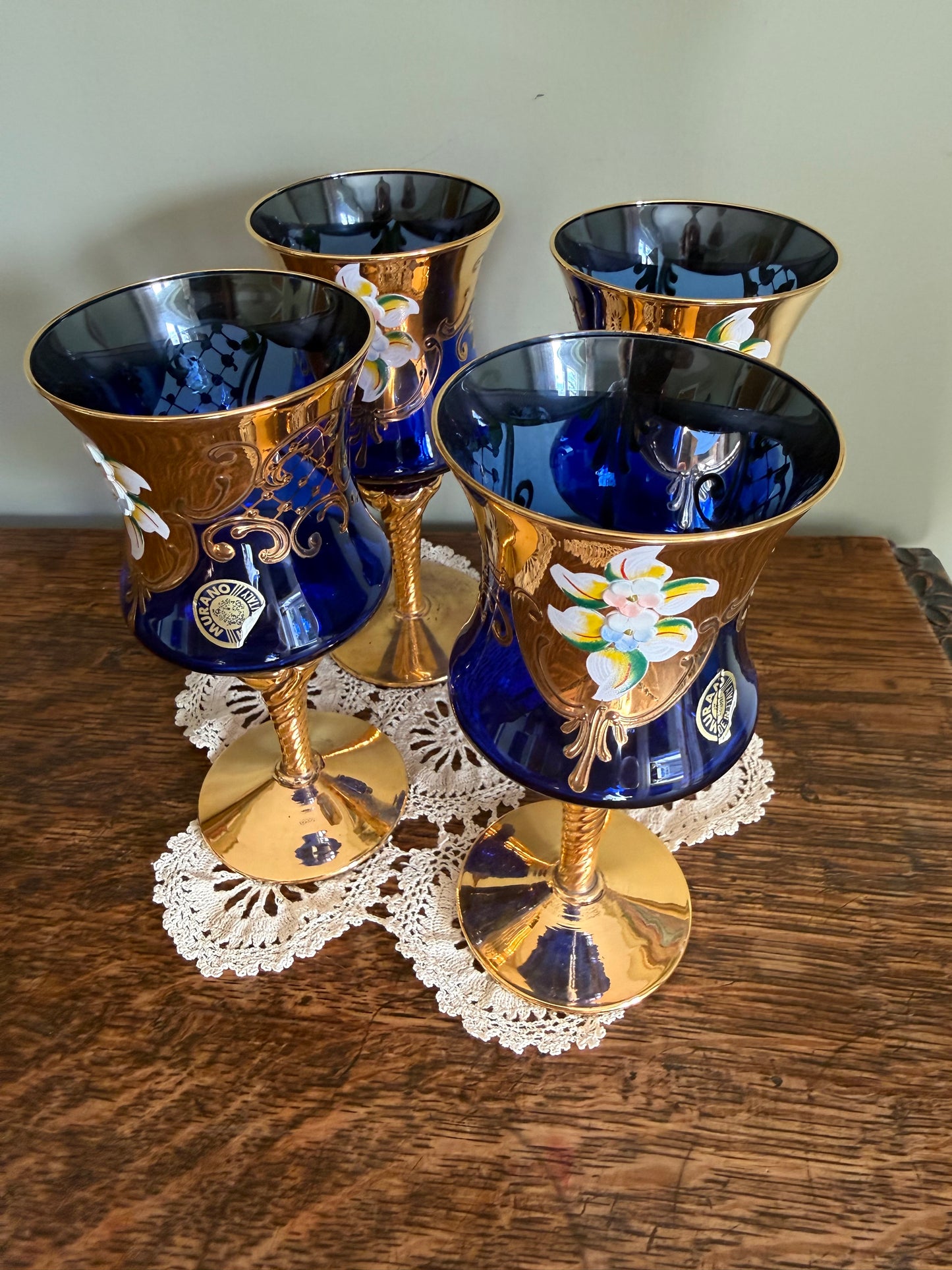Set of 4 Murano cobalt blue and gold Venetian glass goblets with enamel floral decoration.