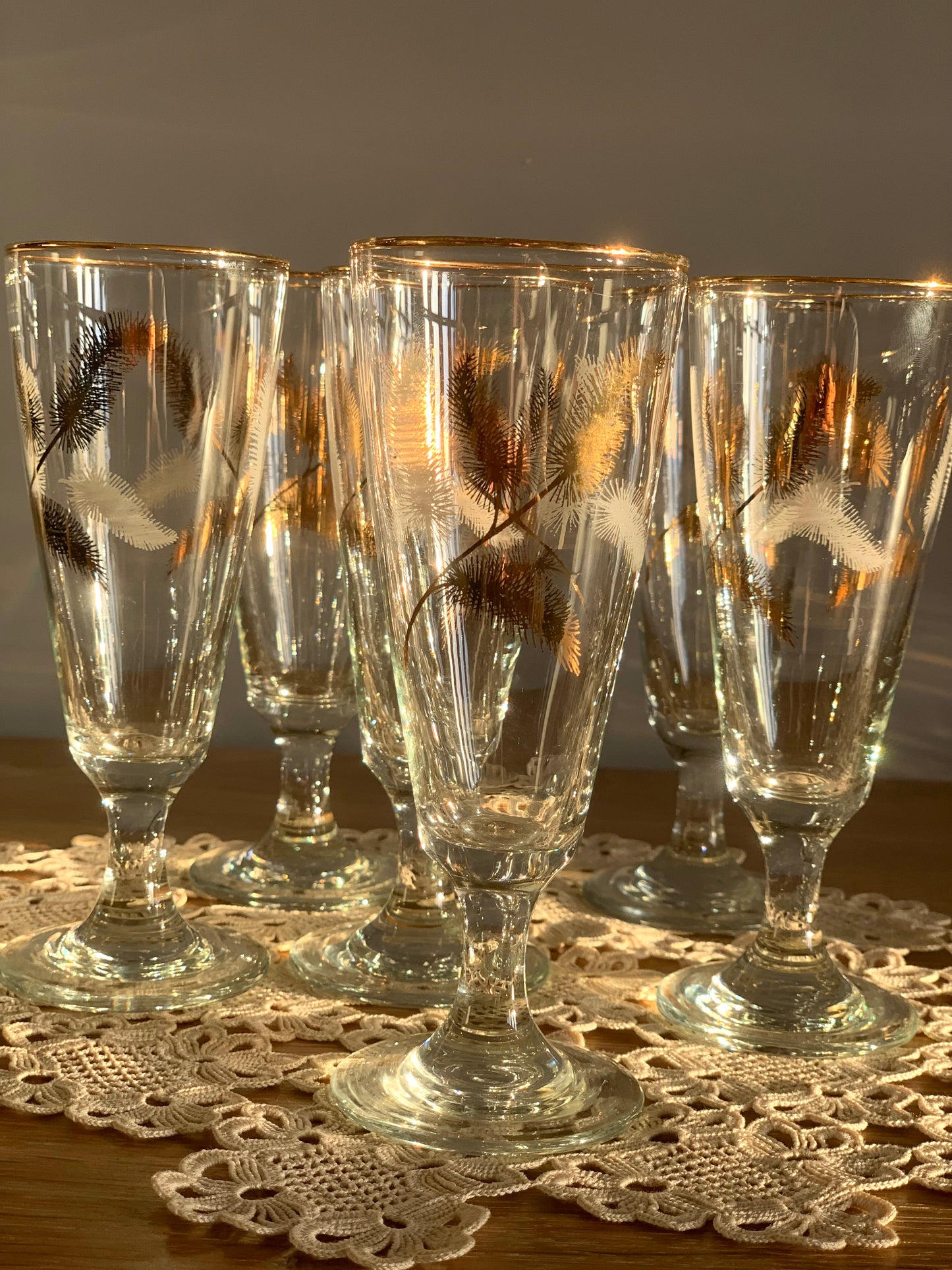 Vintage, gold feather stemmed glasses.