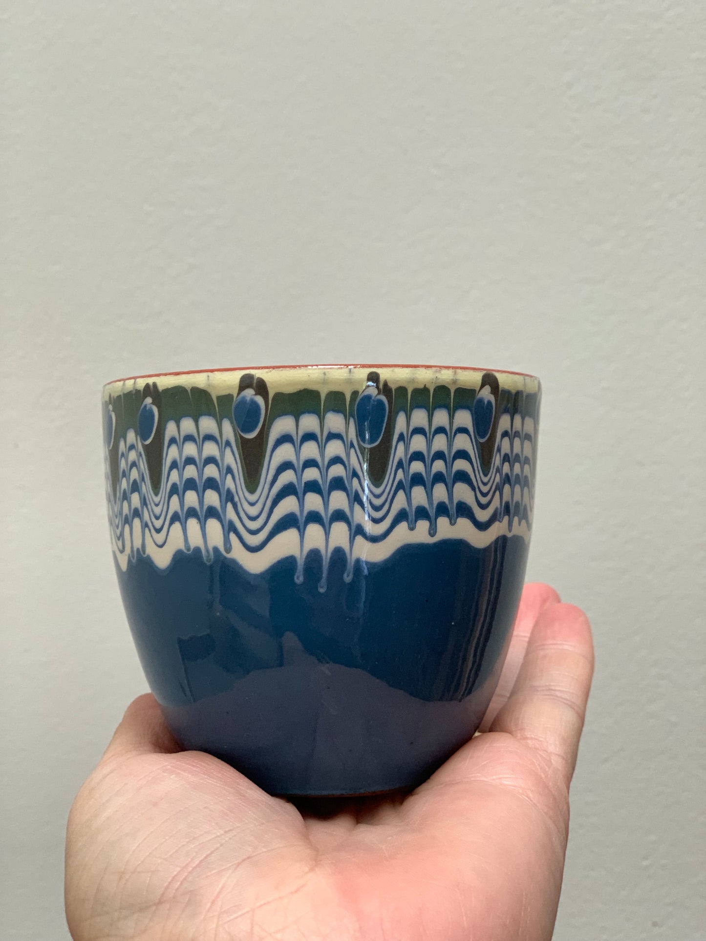 Hand thrown and hand painted, ceramic cups.