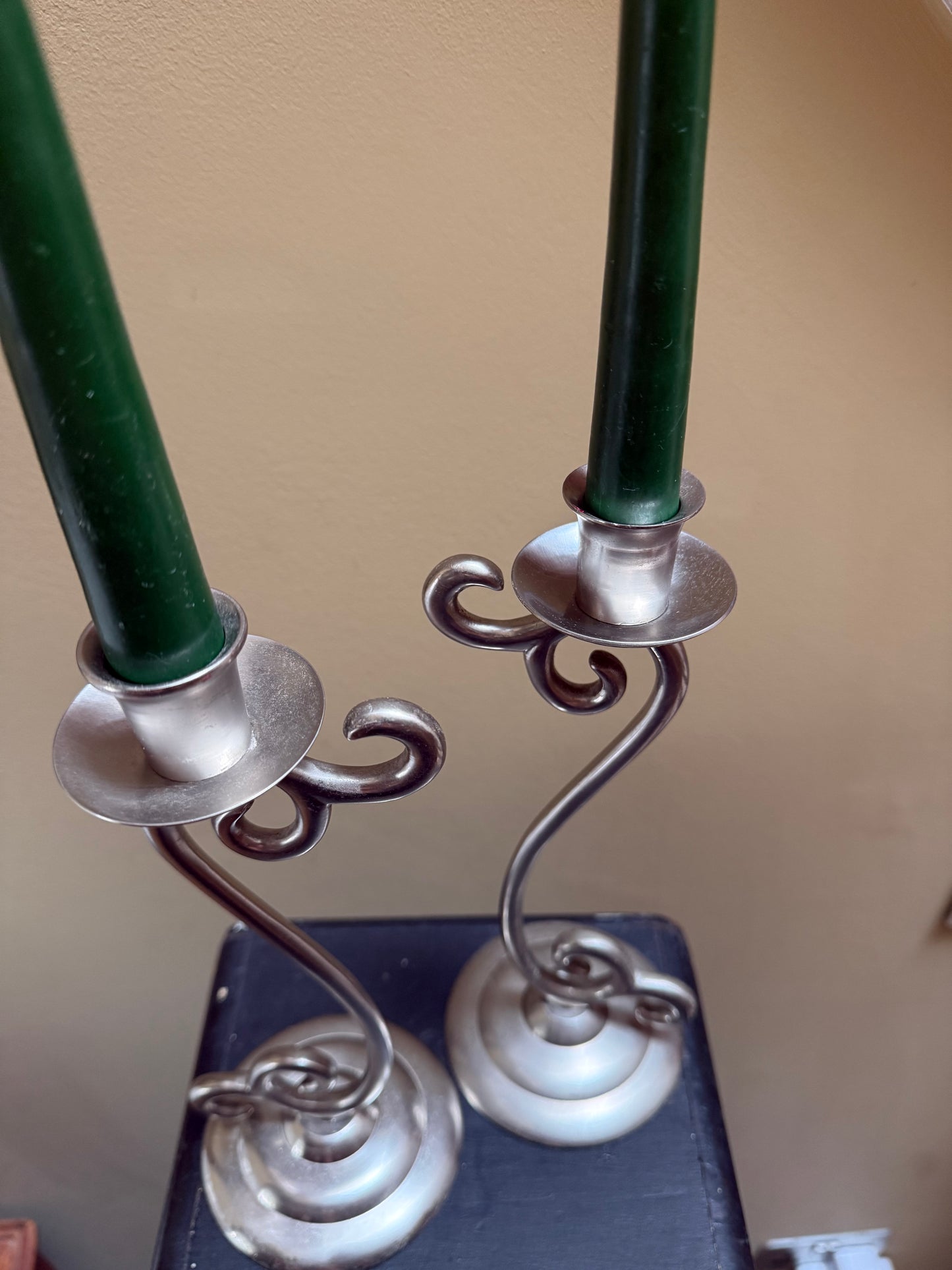 Vintage elegant white metal candlestick holders.