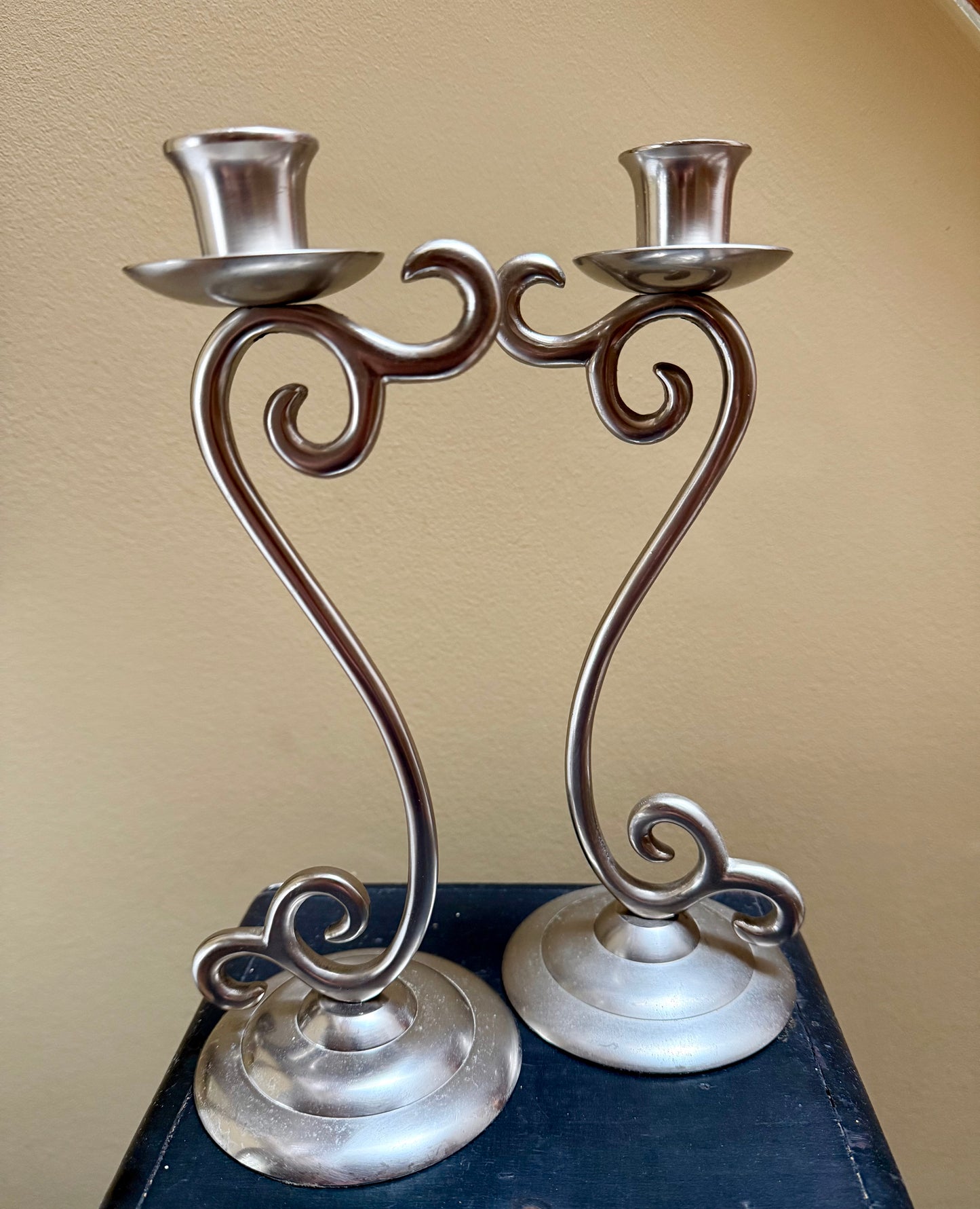 Vintage elegant white metal candlestick holders.