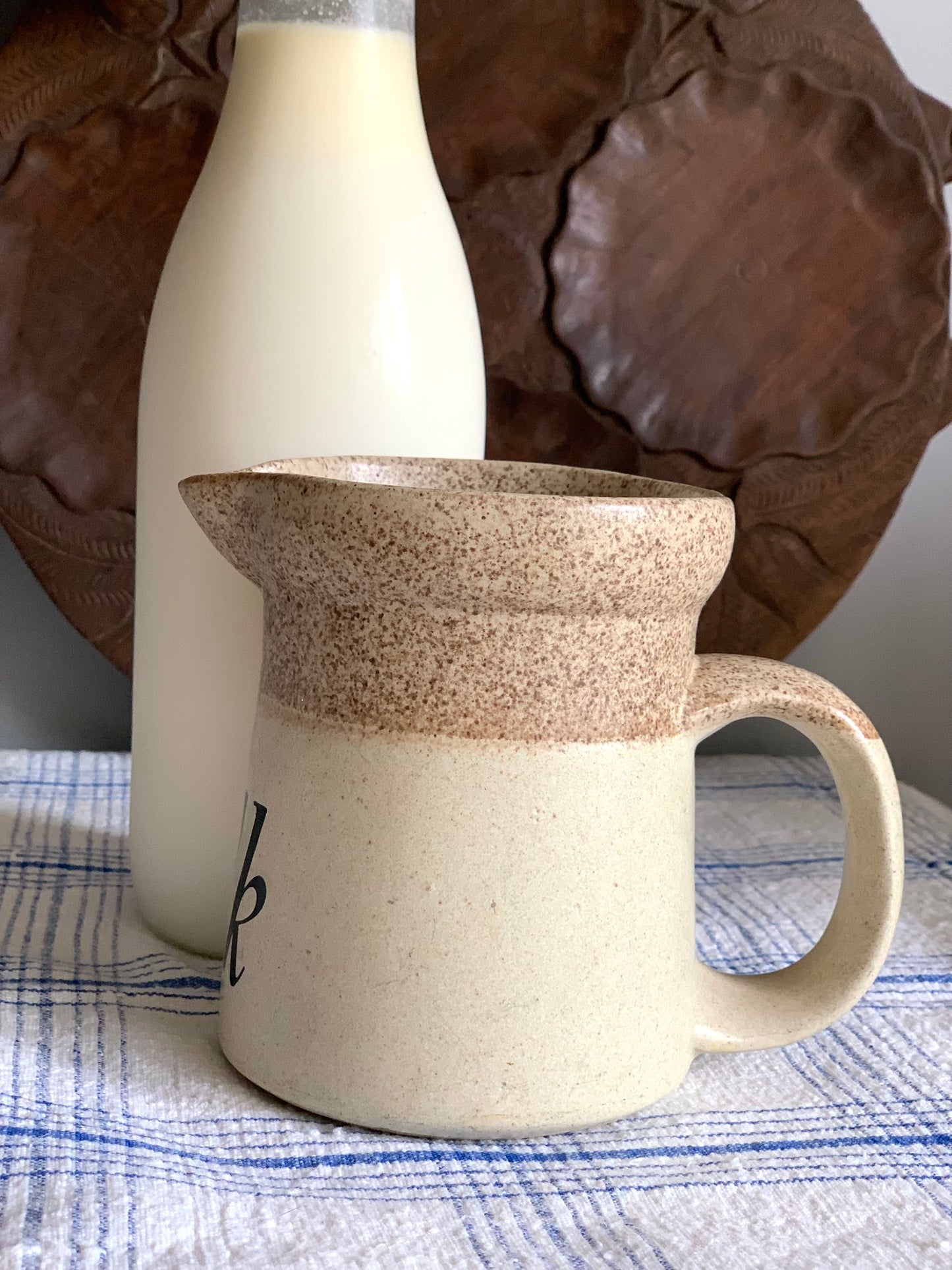 Vintage, handmade, terracotta milk jug.