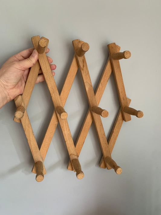 Vintage, wood expandable wall rack.