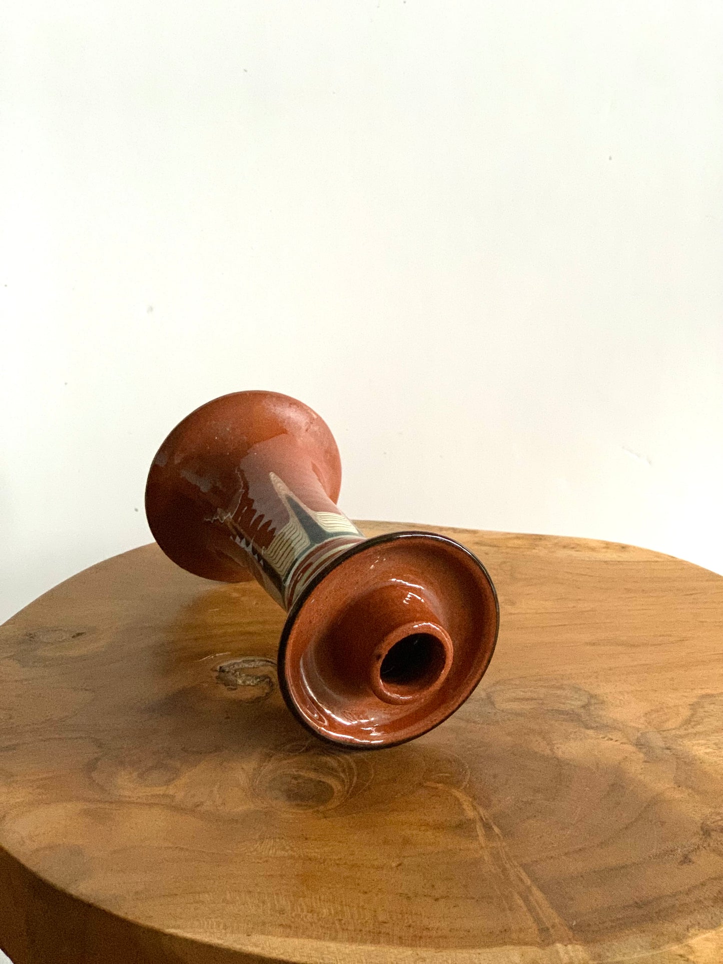 Vintage, handmade and hand painted terracotta candlestick.