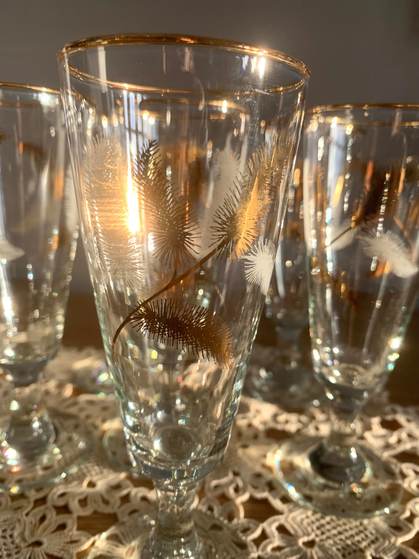 Vintage, gold feather stemmed glasses.