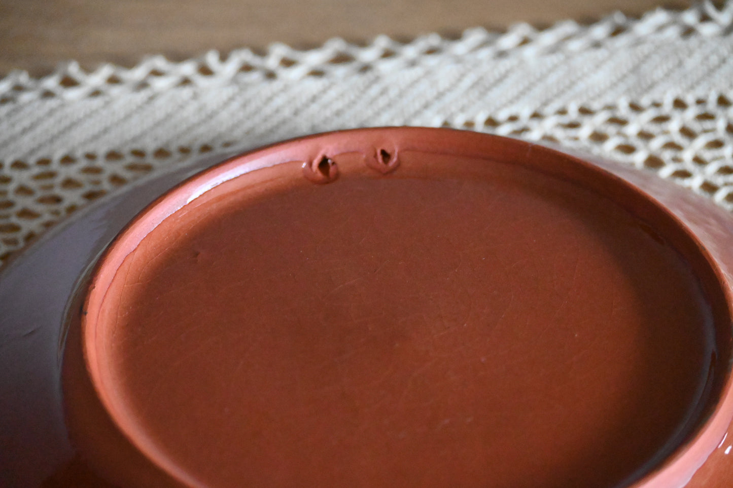 Vintage, handmade terracotta wall plate.