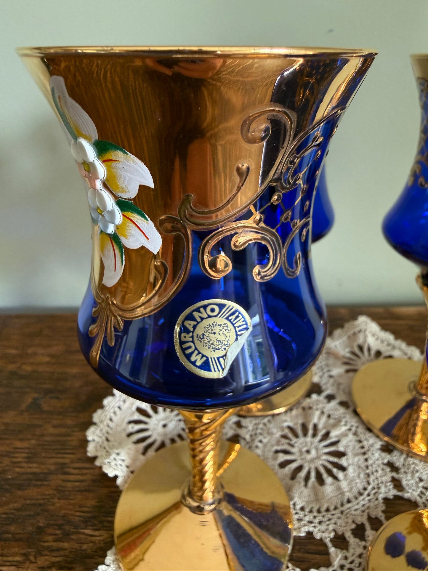 Set of 4 Murano cobalt blue and gold Venetian glass goblets with enamel floral decoration.