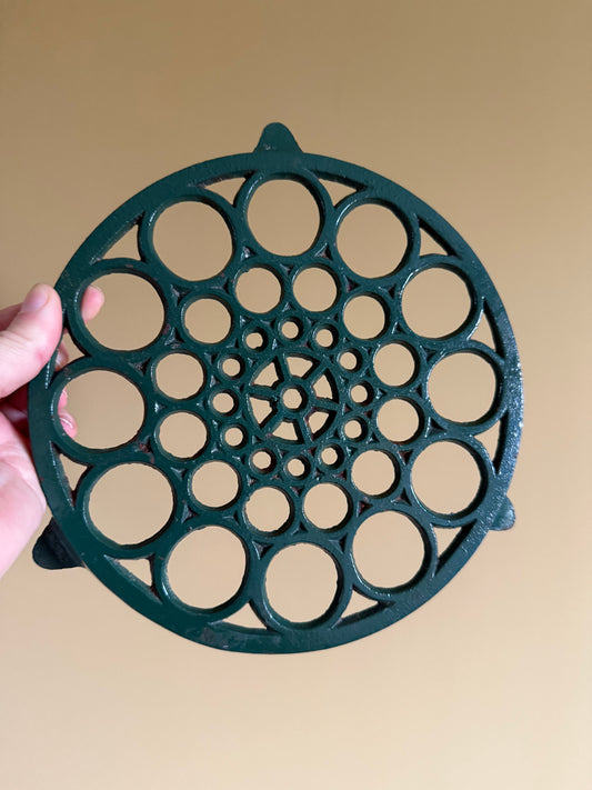 Cast iron trivet.