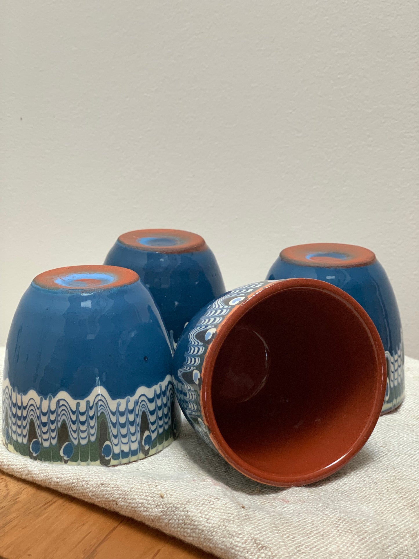 Hand thrown and hand painted, ceramic cups.