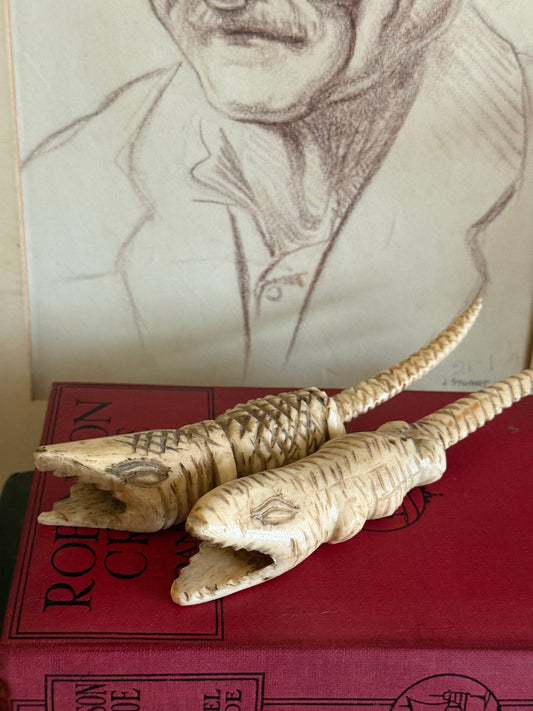 Vintage hand carved bone crocodile sculptures.