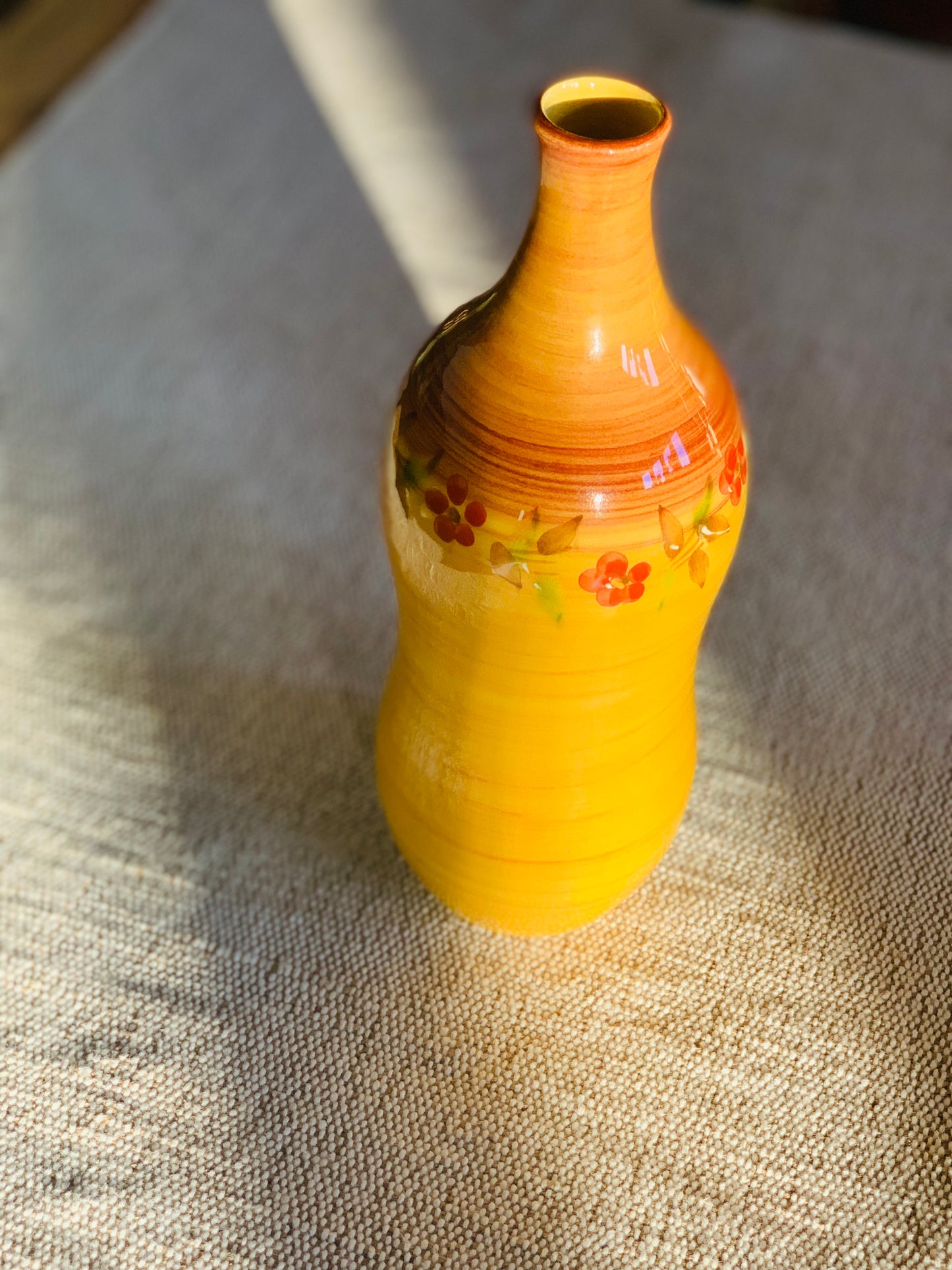 Vintage, handmade terracotta bottle.