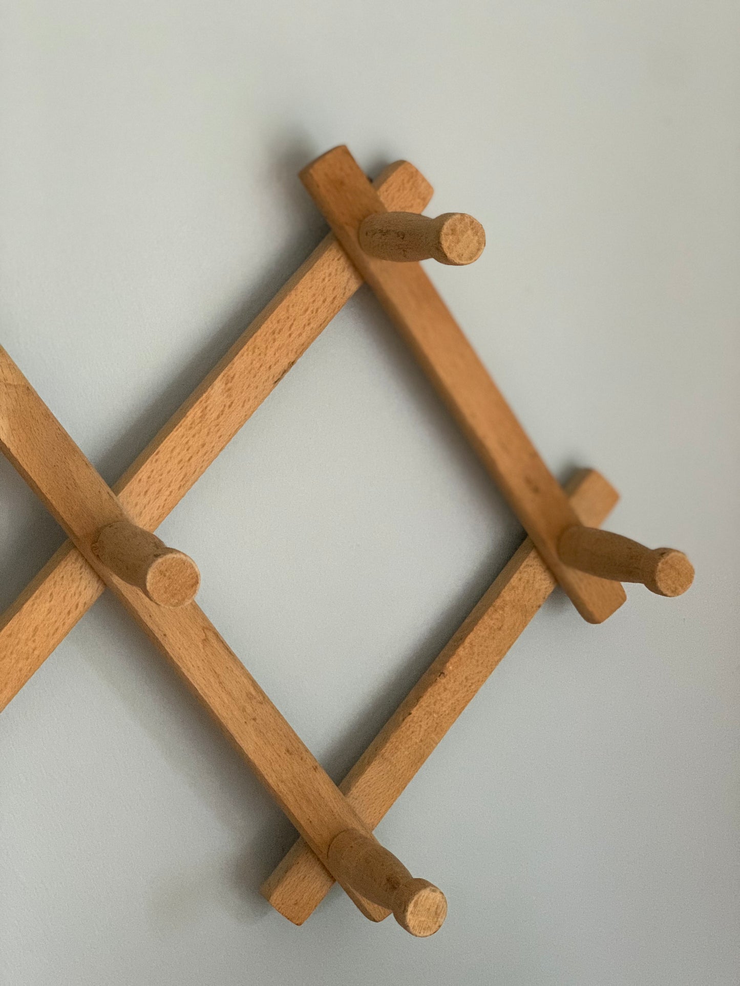 Vintage, wood expandable wall rack.