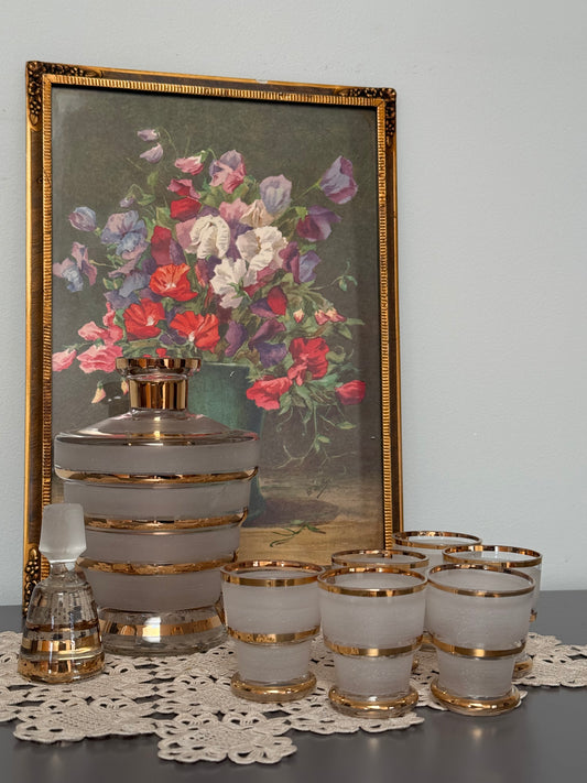 Vintage, liquor frosted glass with gold bands decanter and 6 shot glasses.