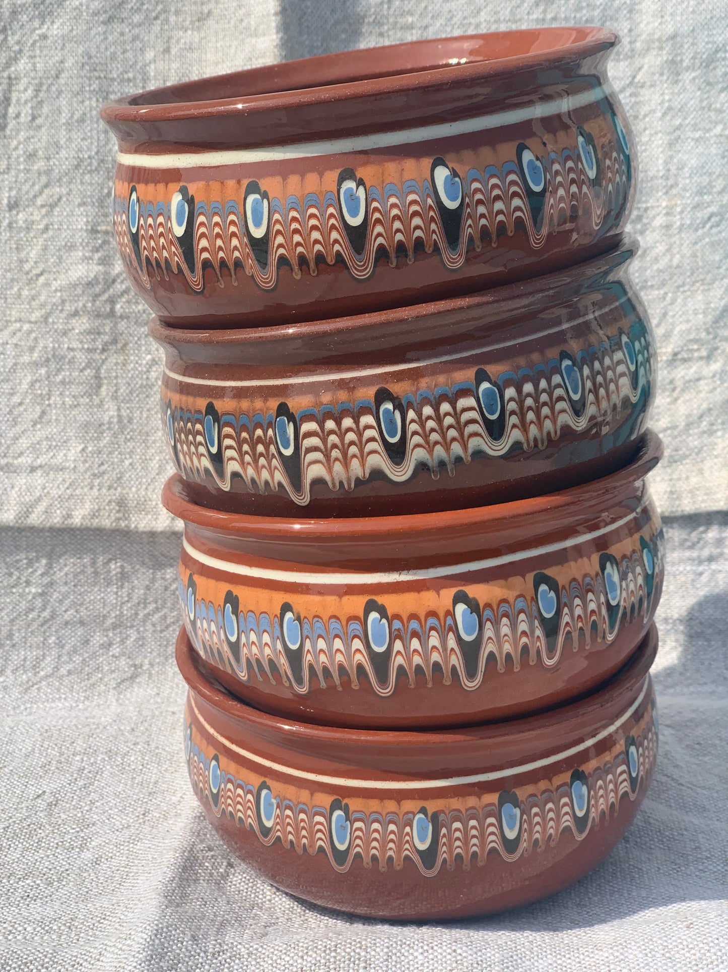 Set of four handmade, ceramic bowls.