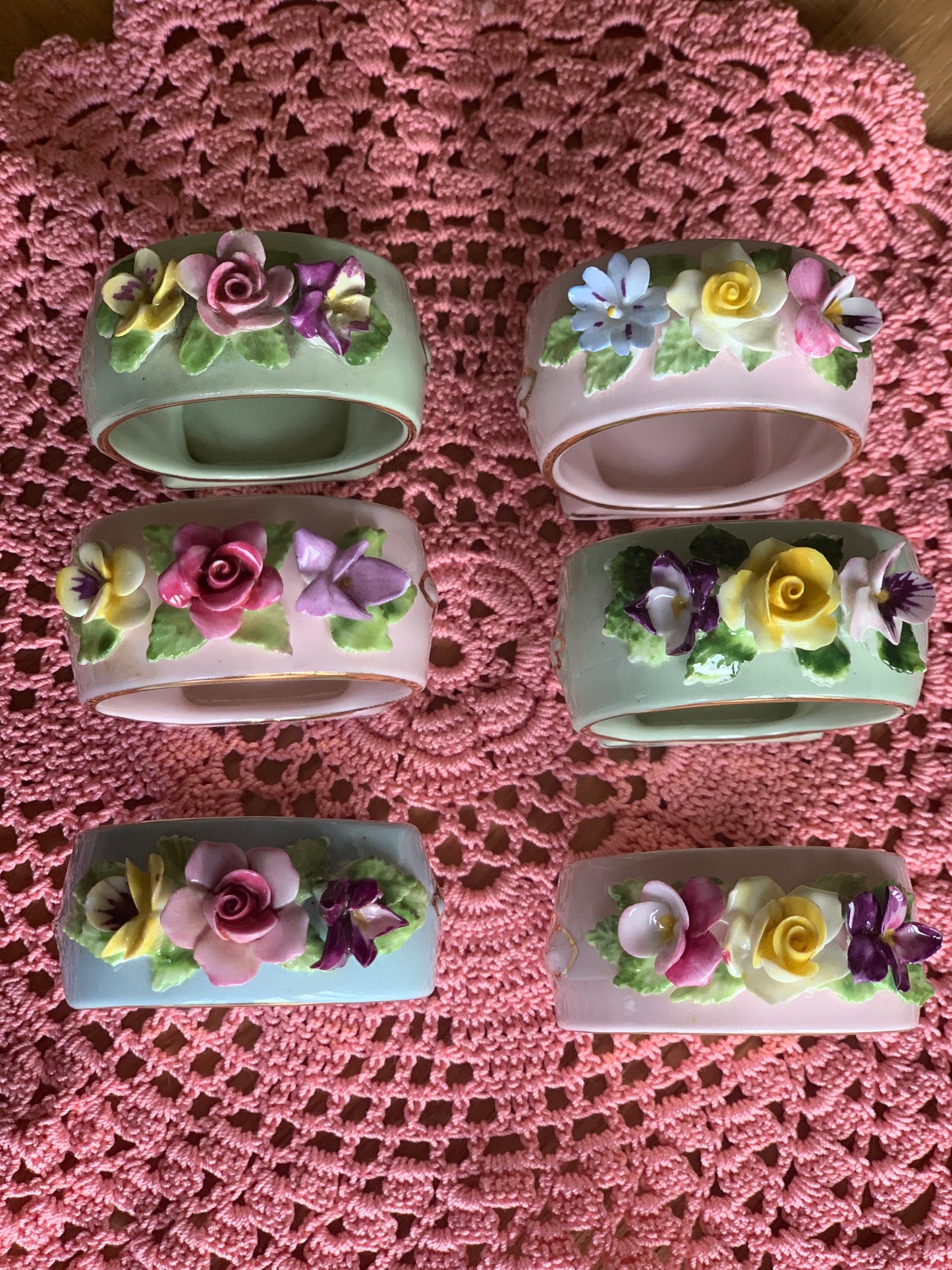 Antique, last century fine bone china, floral napkin rings.