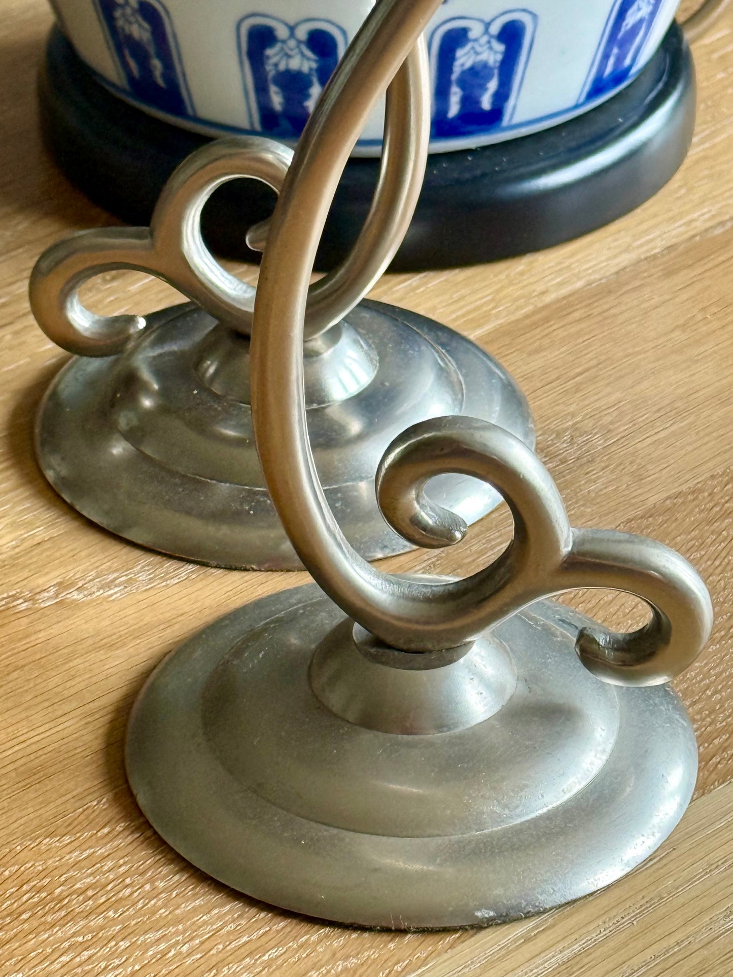 Vintage elegant white metal candlestick holders.
