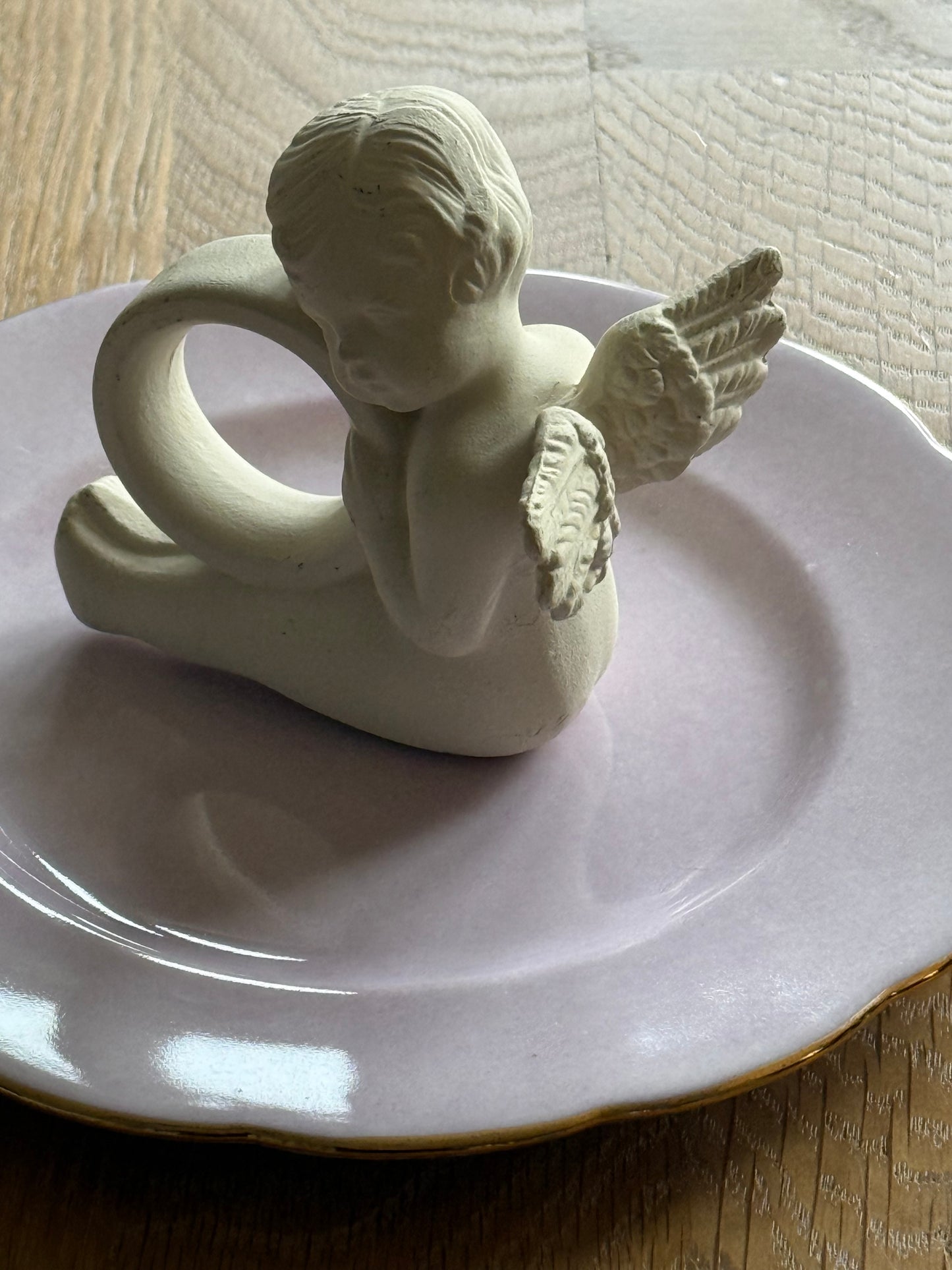 Set of 4 cherub napkin rings.