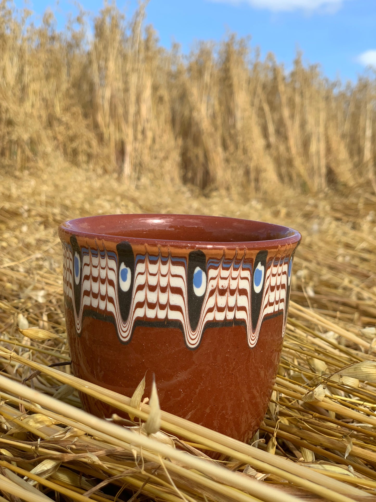 Hand thrown and hand painted, ceramic cups.