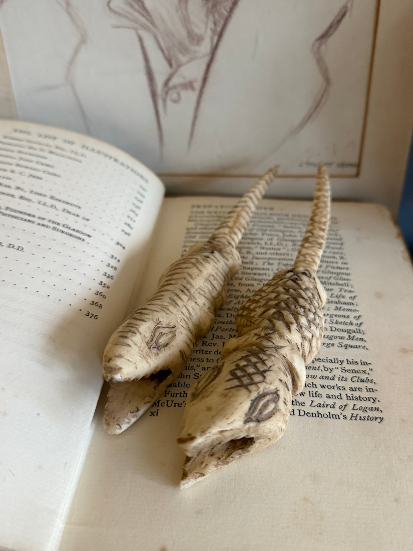 Vintage hand carved bone crocodile sculptures.